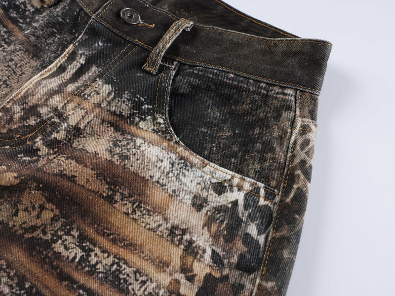 Side waist detail of animal print jeans with pocket and belt loop