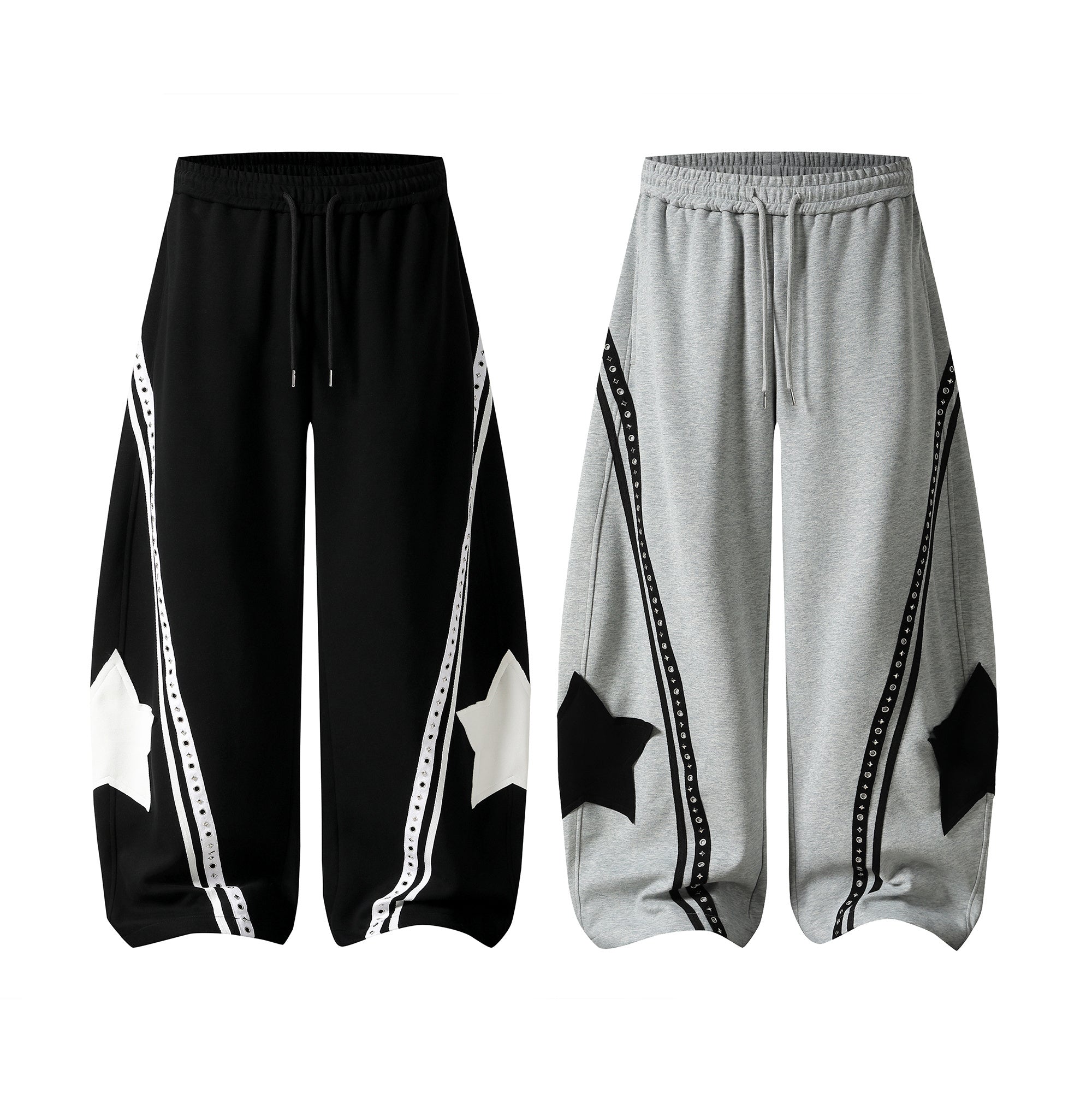 Omirad Star Panel Track Pants in black and grey with star applique and contrast stripe detailing, wide-leg relaxed fit