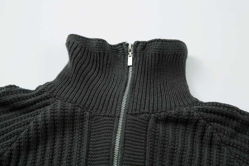 Close-up of dark ribbed knit sweater collar with centered zipper