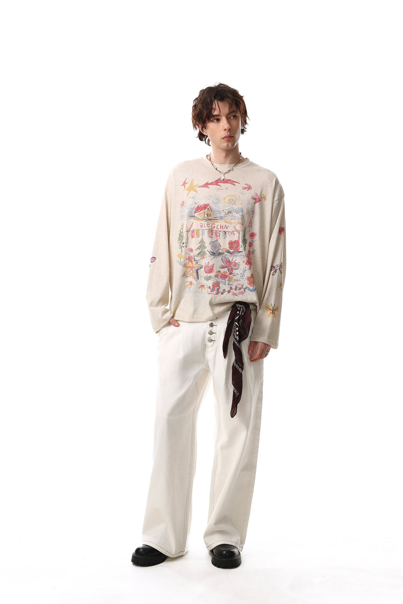 Model wearing cream long sleeve tee with colorful hand-drawn front print and butterfly sleeves