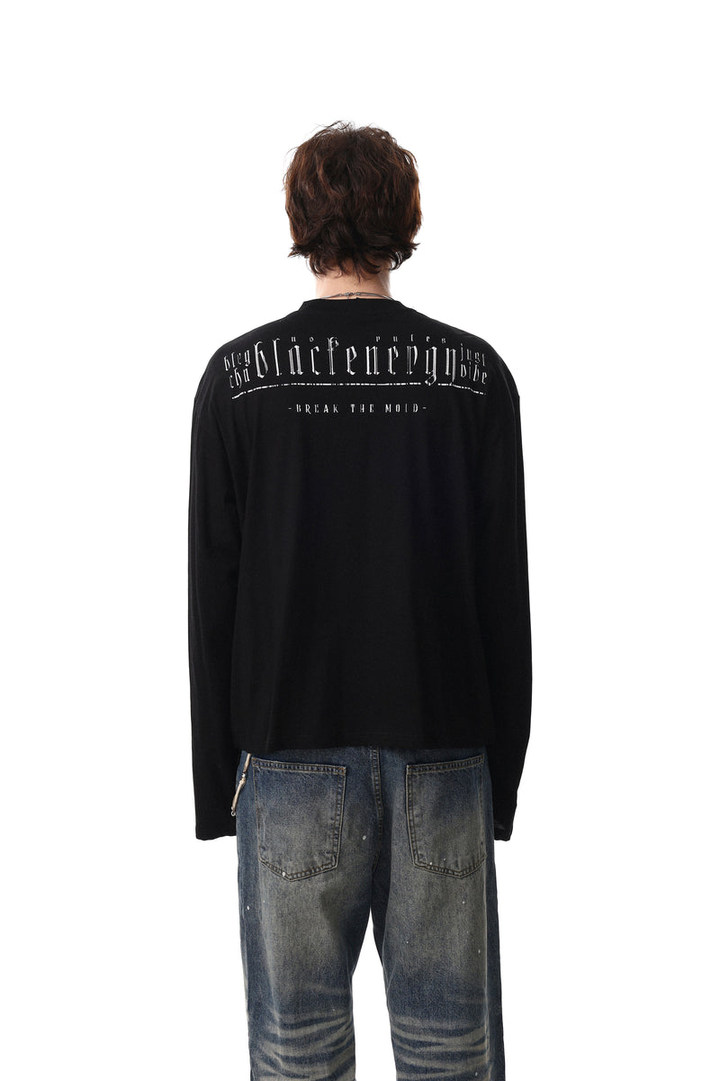 Black henley tee worn by model, back view with printed text