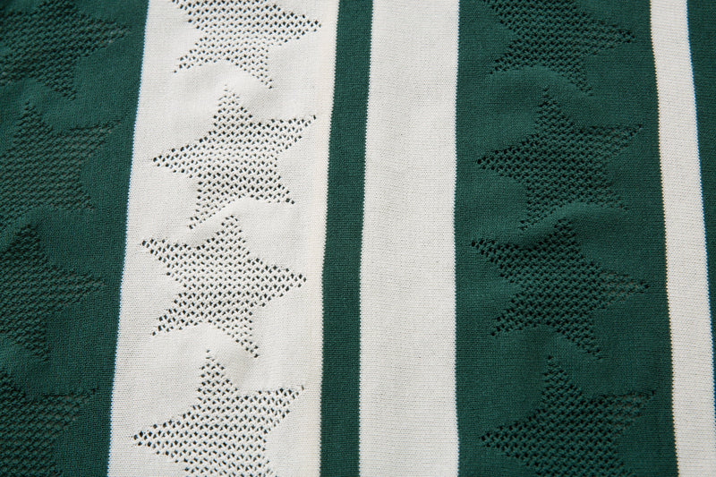 Close-up of green and cream striped knit fabric with raised star pattern