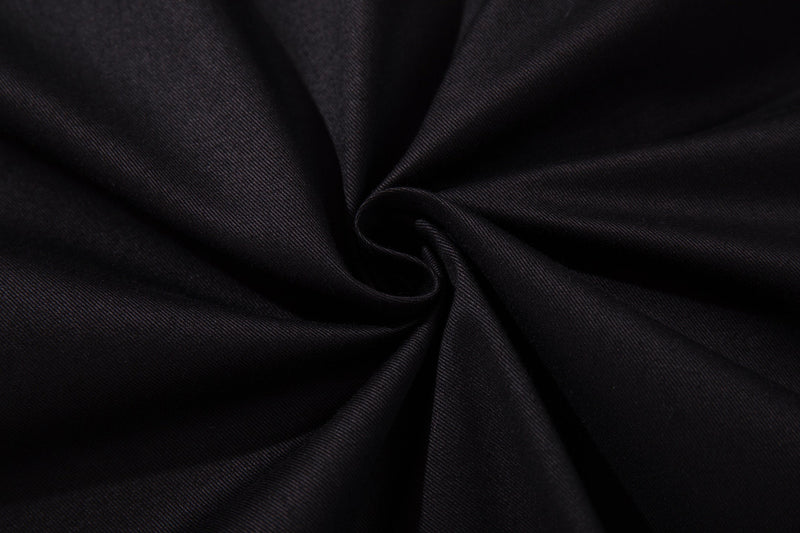 Close-up of black button-up shirt fabric with a smooth twisted drape and subtle woven texture
