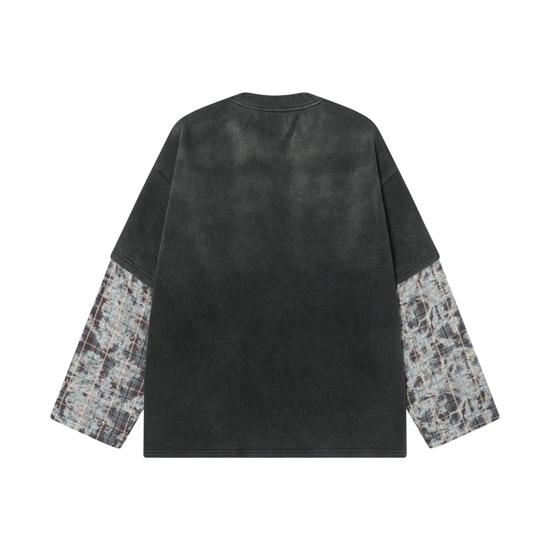 Back view of black long sleeve tee with washed finish and plaid layered sleeves