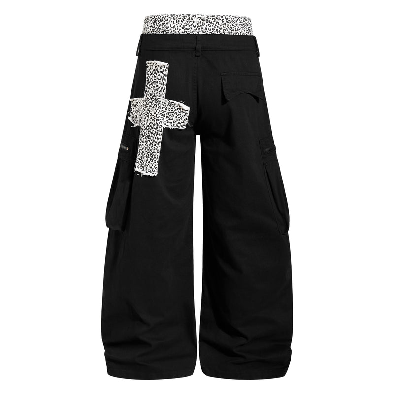 Back view of black wide-leg cargo pants with leopard-print waistband and frayed patch detail