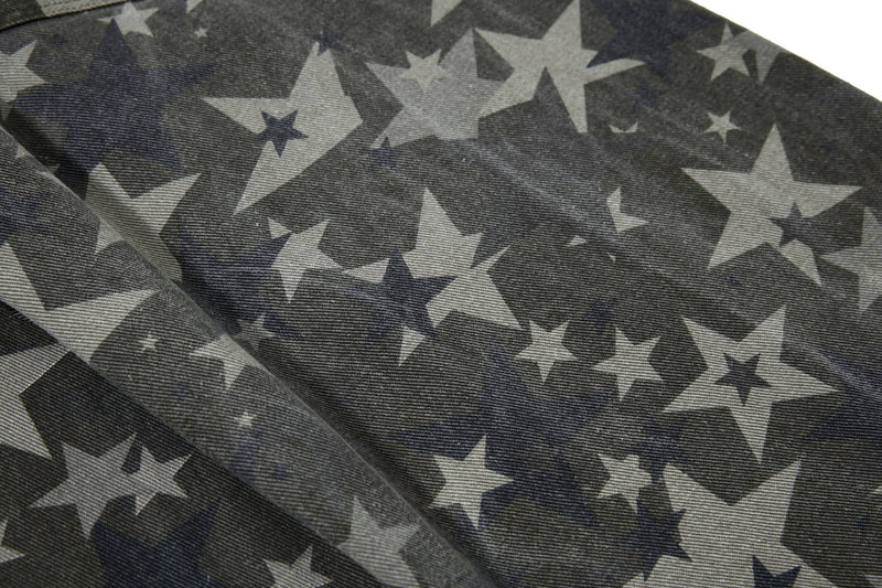 Close-up of folded star print denim showing the fabric pattern