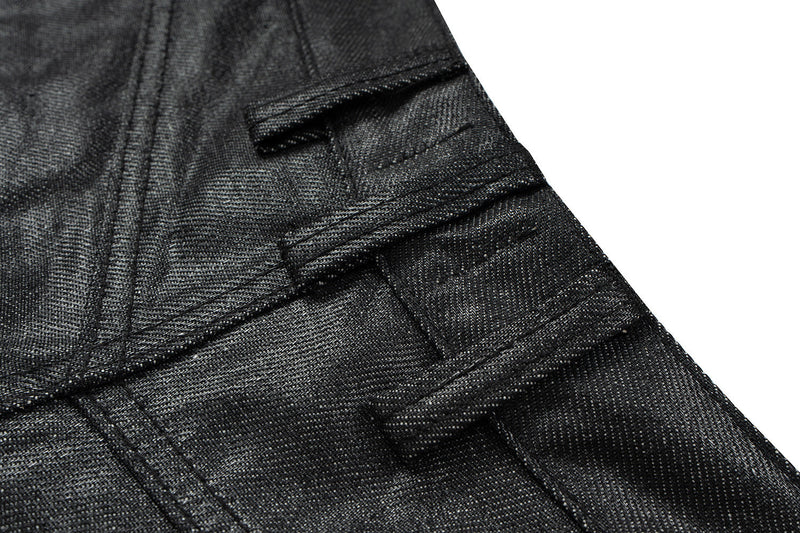 Close-up of black denim side seam and belt loop detail