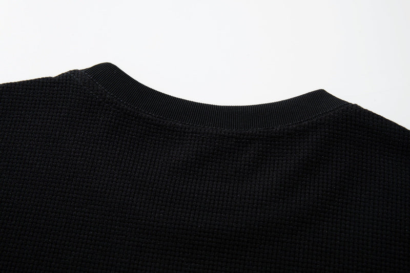 Black textured cotton graphic tee with ribbed crew neck and dark gothic punk style fabric detail