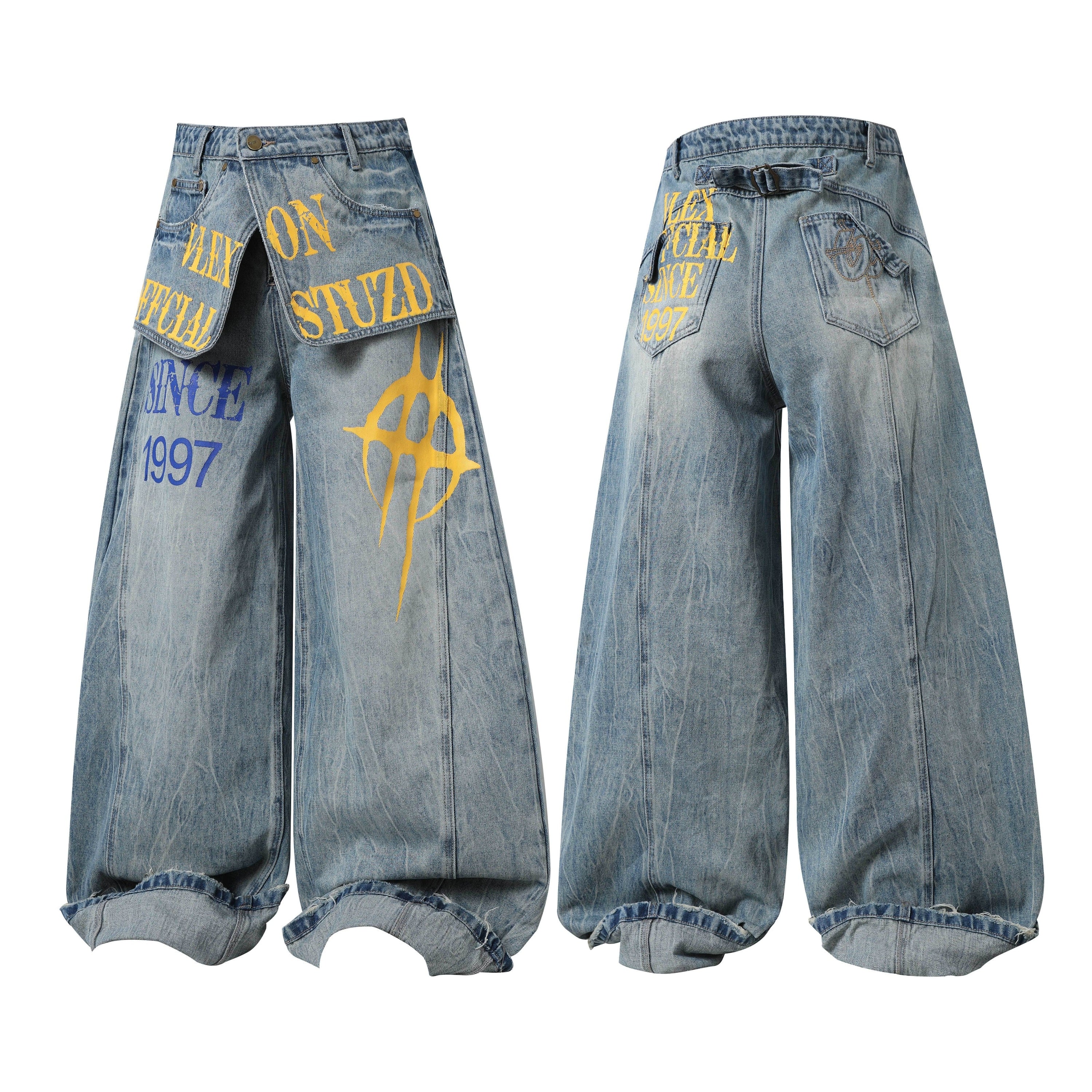Front and back view of wide-leg washed denim jeans with yellow and blue graphic text print and bold emblem design