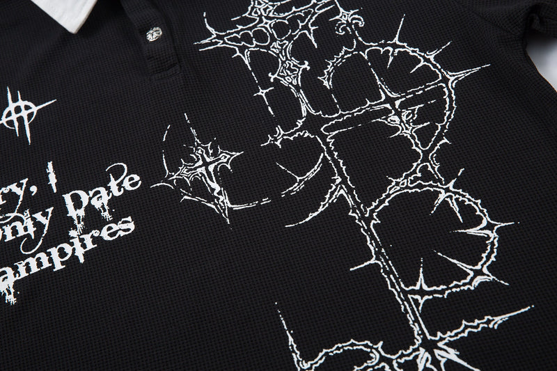Black polo shirt with white thorn cross graphic and gothic text print on textured fabric