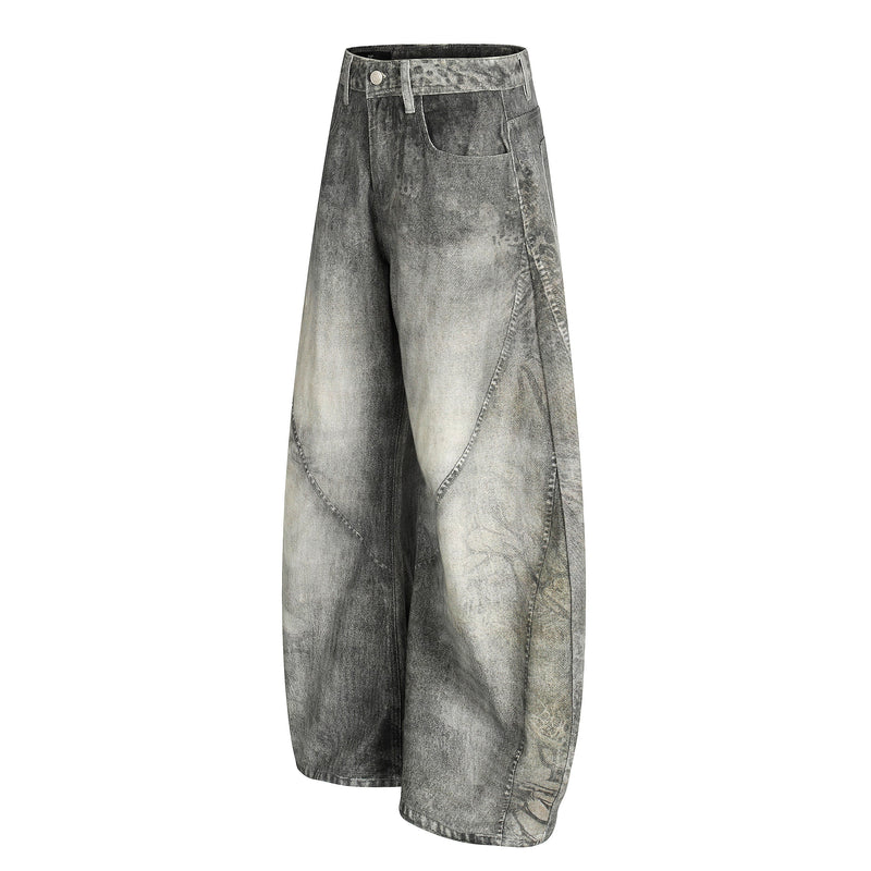 Side view of gray washed curved barrel-leg denim pants with wide silhouette