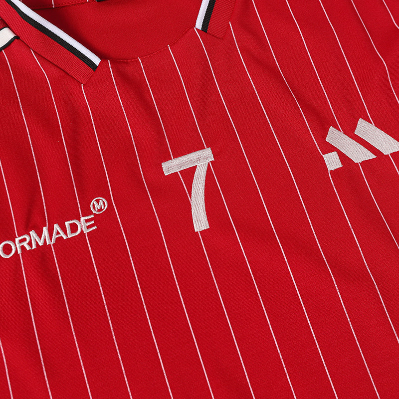 Red pinstripe soccer jersey with white V-neck trim, embroidered number 7, and streetwear style branding