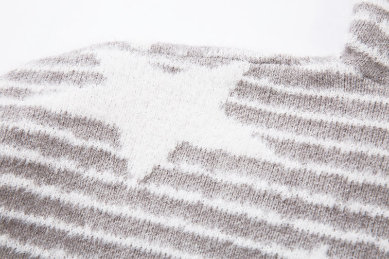 Close-up of a white star on gray striped knit fabric
