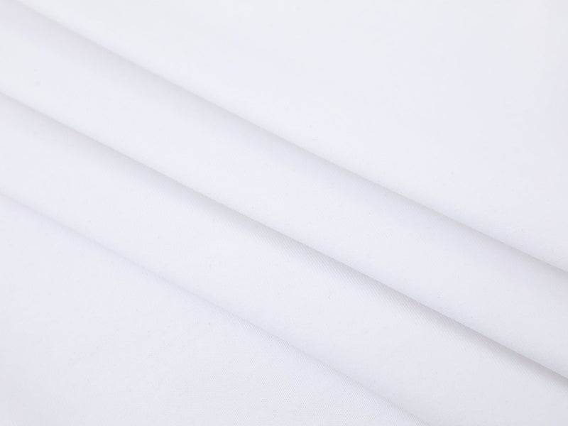Close-up of white shirt fabric with diagonal fold lines