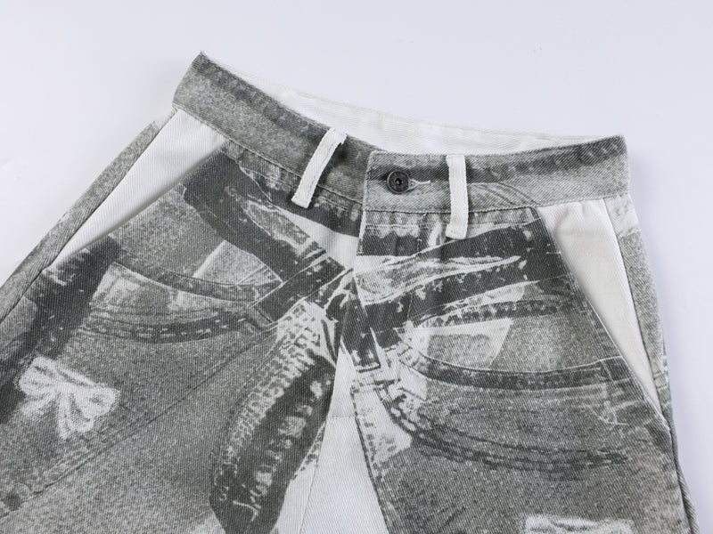 Close-up of gray pants waistband with button and white drawstring
