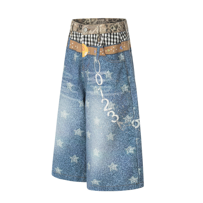 Side view of blue patchwork denim shorts showing front graphic and plaid waistband detail