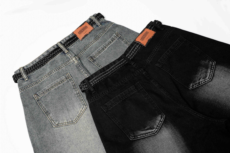 Blue and black jeans shown side by side with braided waist and back pocket details