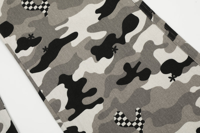 Close-up of grey camouflage cargo pants leg with checkerboard patch
