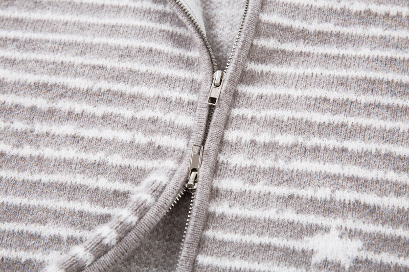 Close-up of the front zipper pull on gray striped knit jacket