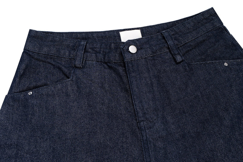 Top front close-up of dark indigo denim shorts with button waistband and belt loops