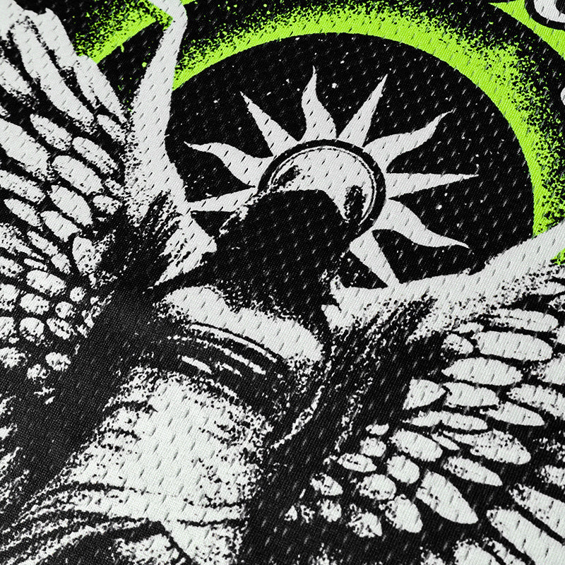 Close-up of black mesh football jersey with white gothic angel graphic and neon green circular accents
