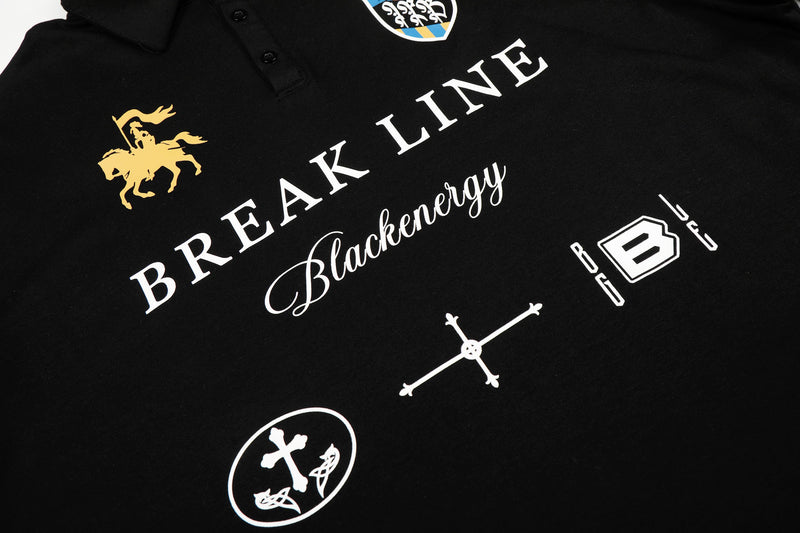 Close-up of black polo shirt graphic text and chest prints