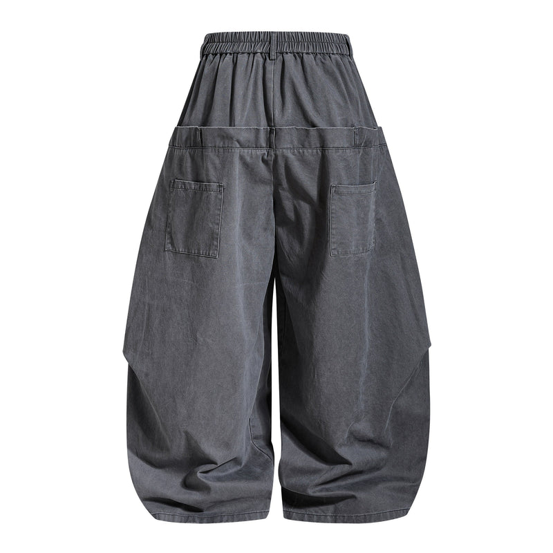 Dark gray pants back view with elastic waistband and large back patch pockets