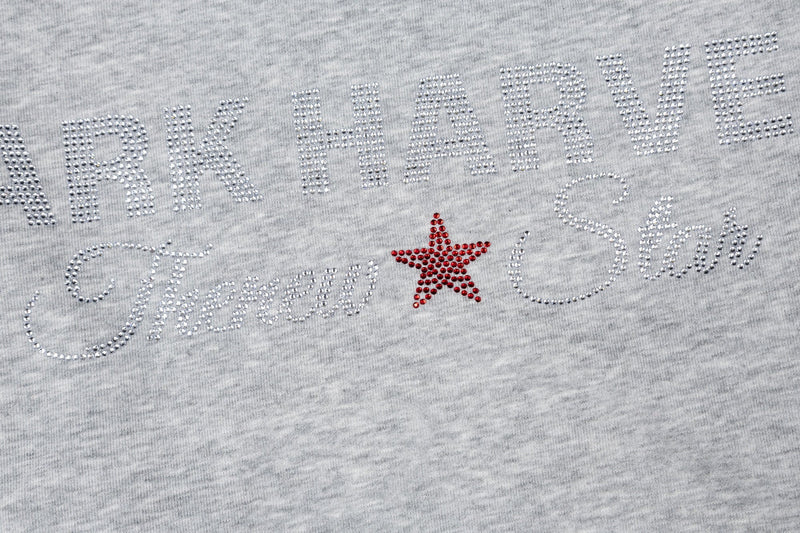 Close-up of Dark Harvest Threw Star rhinestone front graphic on heather gray tee