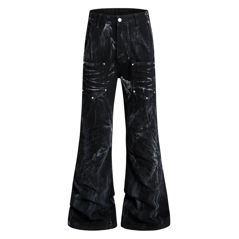 Front view of black washed cargo flare jeans with flap leg pockets