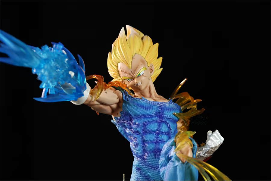 The Seakoff Vegeta Super Saiyan Collectible Figure (45cm) features interchangeable heads and glowing effects, depicting a Dragon Ball Z character with spiky yellow hair and green eyes, posed to attack with a blue energy blast.