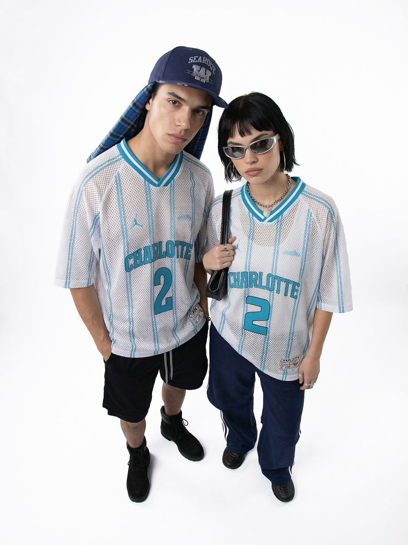 Two models wearing white Charlotte Ball #2 mesh jersey T-shirts with blue stripes and streetwear styling on a white background