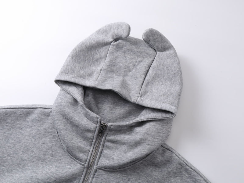Gray hoodie devil-ear hood detail with front zipper partially closed