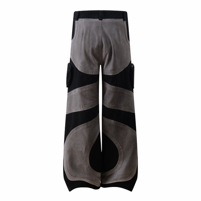Back view of wide-leg cargo pants with curved contrast paneling and side cargo pockets
