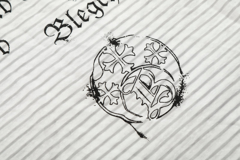 Close-up of circular crest graphic on white striped hoodie tee