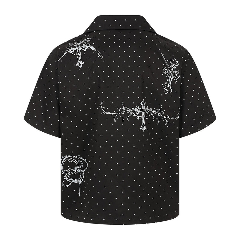 Black polka dot shirt with white cross graphics, back view