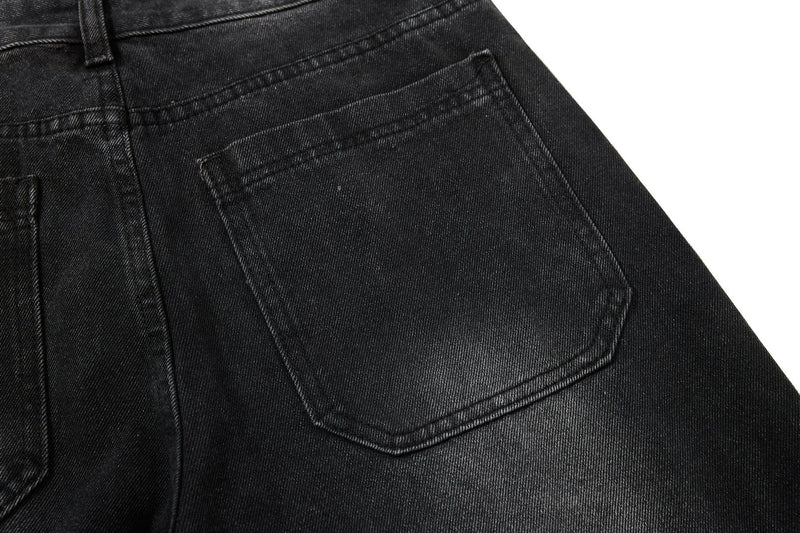 Back pocket close-up on black denim jeans