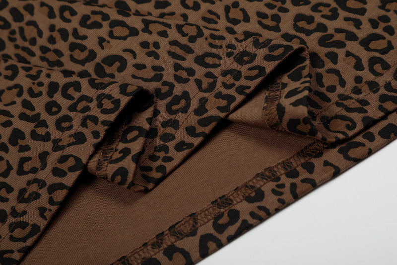 Close-up of brown leopard print polo tee fabric with stitched seams and textured knit details