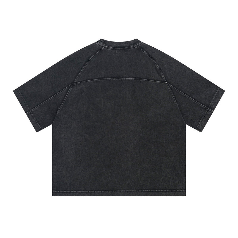 Black vintage washed oversized cotton T-shirt with raglan sleeves and streetwear fit, shown flat on a white background