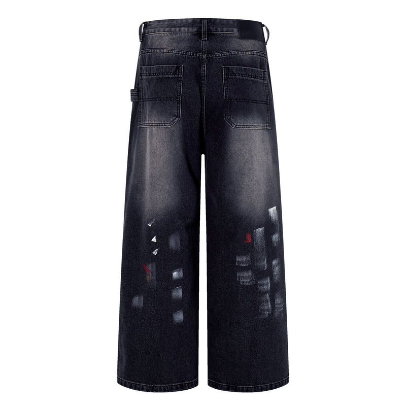Back view of dark wash wide-leg jeans with patch pockets and brushstroke fade