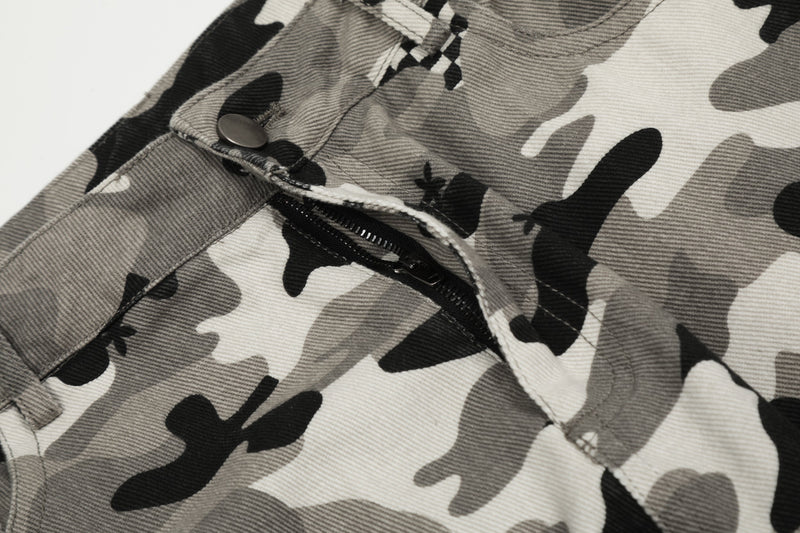 Close-up of front pocket zipper and waistband on grey camouflage pants