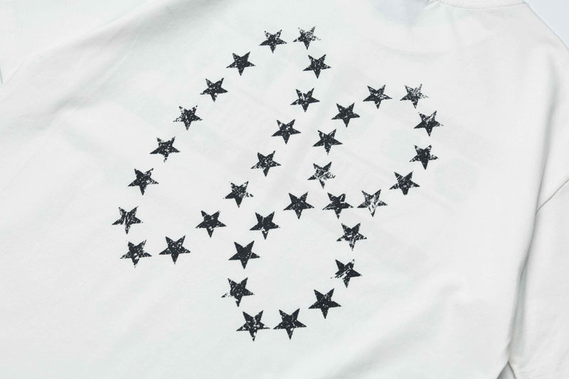 White graphic T-shirt with a faded black star crest design on the back, giving a vintage retro streetwear look