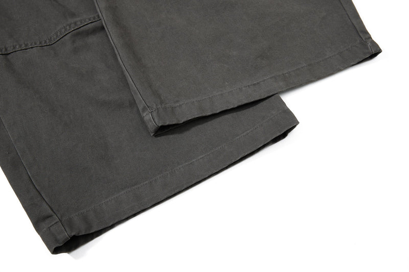 Close-up of black wide-leg pant hem with straight stitched cuff