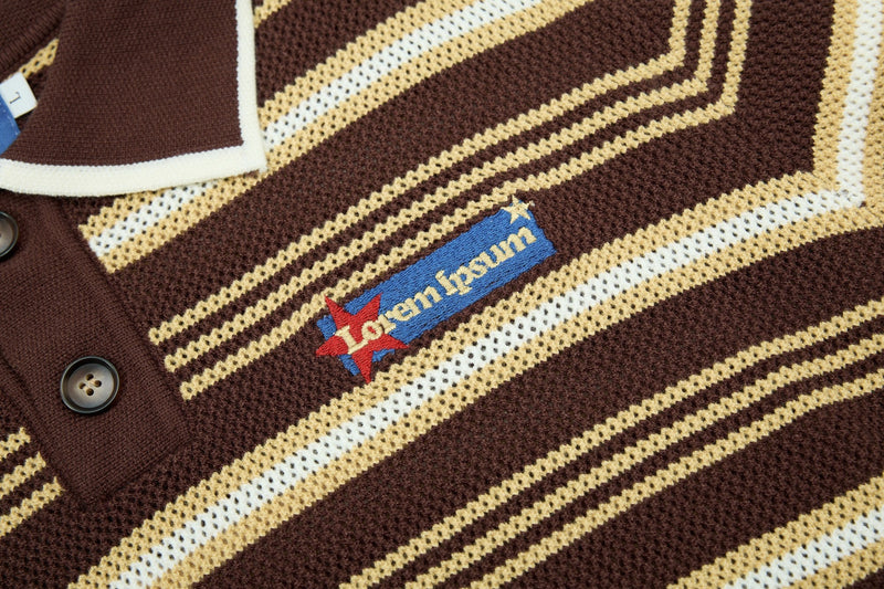 Close-up of a brown knit polo with cream retro stripes, button placket, and embroidered collegiate-style chest logo