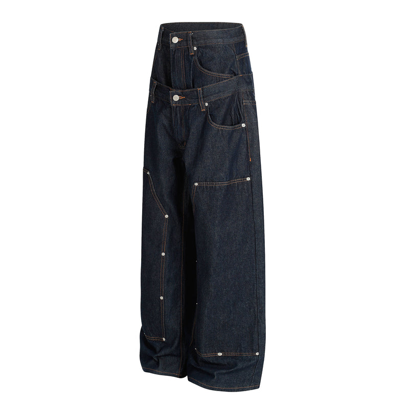 Angled front view of deep indigo wide-leg jeans showing the double waist and oversized pockets