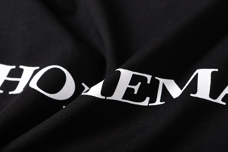 Close-up of black fabric with large white HOMEMADE lettering
