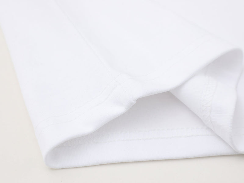Close-up of white shirt fabric showing smooth knit texture