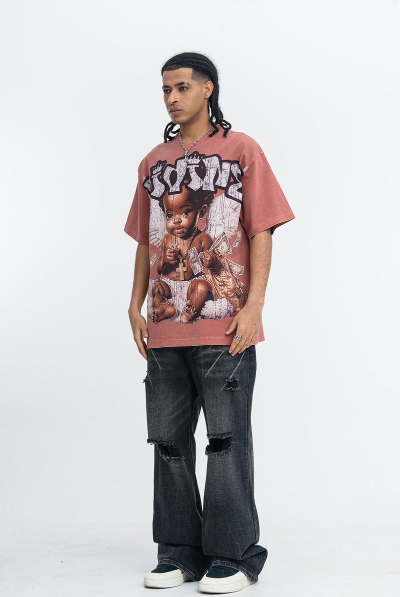 Oversized vintage wash graphic T-shirt in faded rose, featuring a baby angel print with dark distressed jeans and sneakers