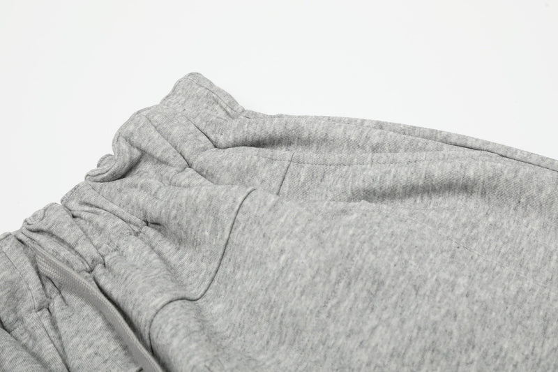 Gray elastic waist and upper leg detail on wide lounge shorts