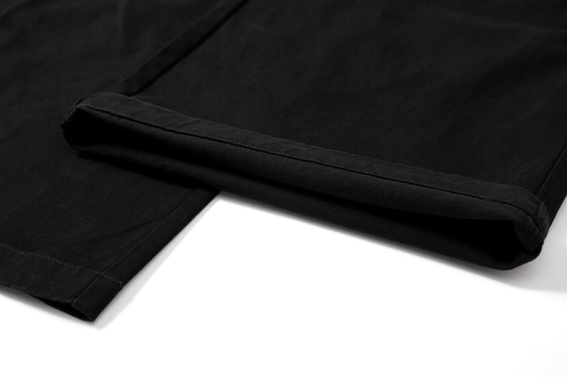 Close-up of hem cuff on black cargo pants