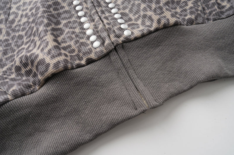 Close-up of heather gray ribbed hem and leopard print lower front